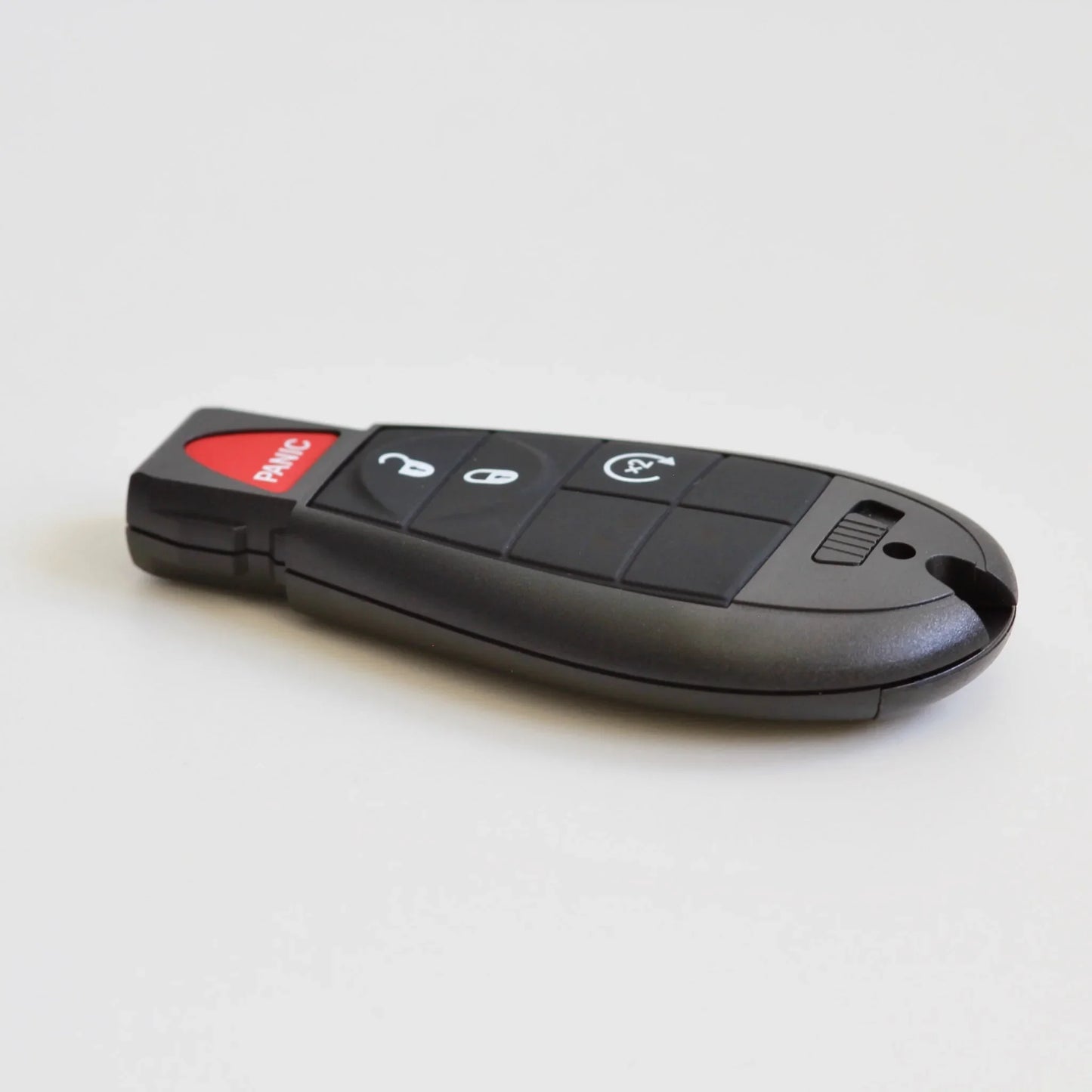 Chrysler remote key fob with unlock, lock, and panic buttons on a white background