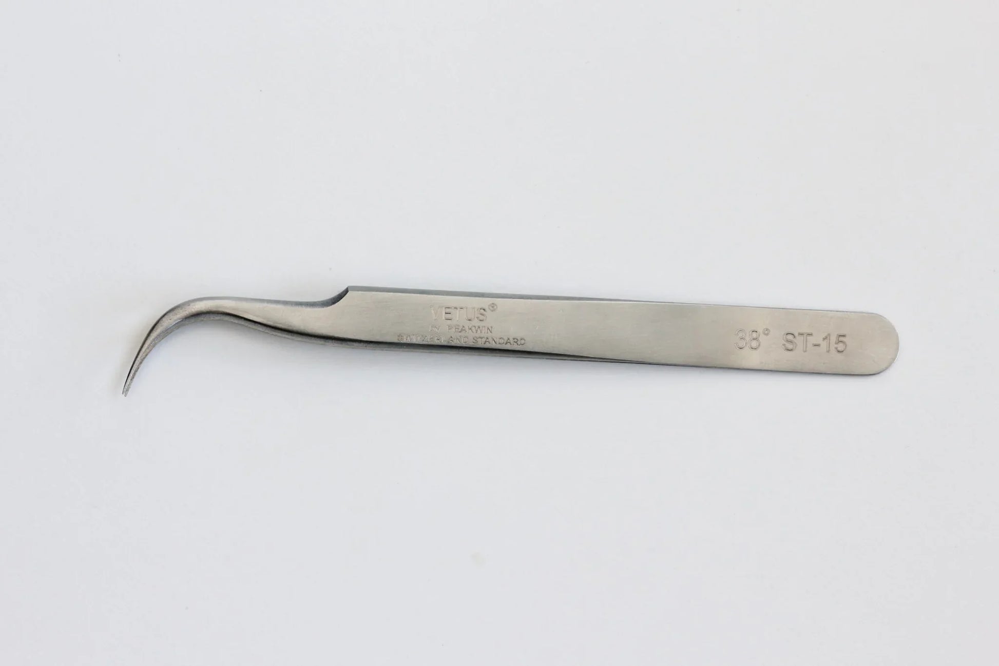 Stainless steel curved precision tweezer tool with 38° ST-15 marking on white background