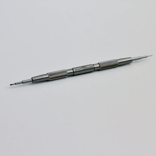 Double-ended stainless steel watch repair tool with textured grip on white background